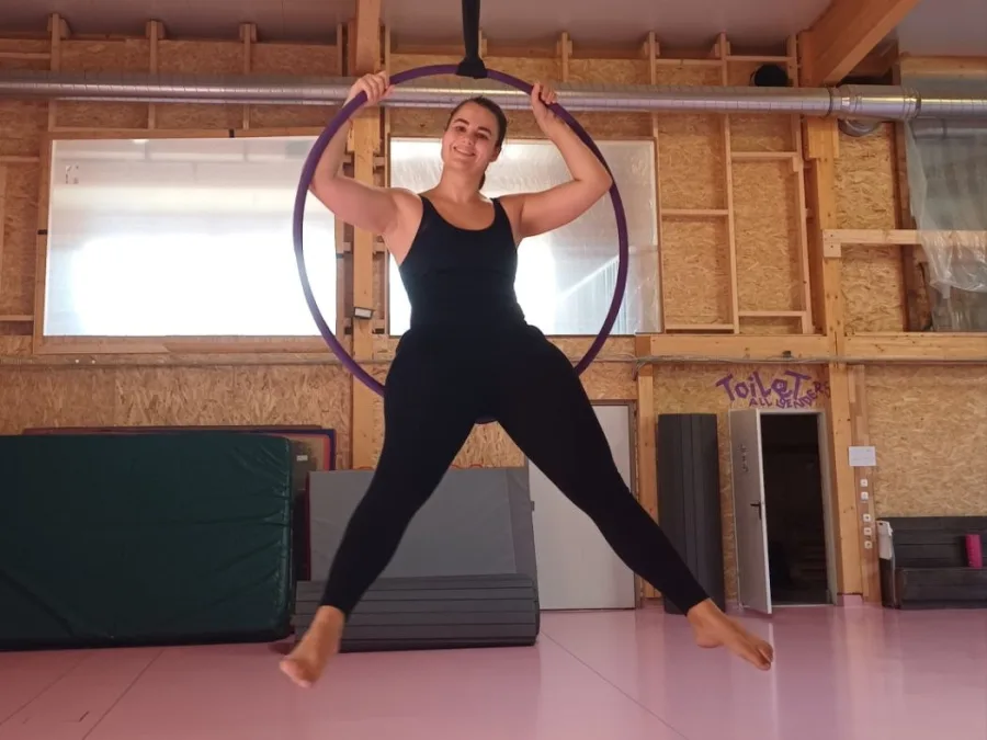 Eleni training on an aerial hoop in a movement studio